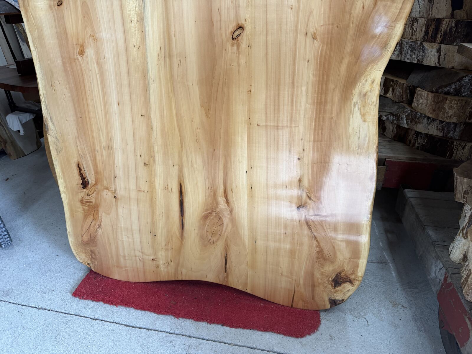 Wide finished live-edge hardwood slab with rich natural grain figure